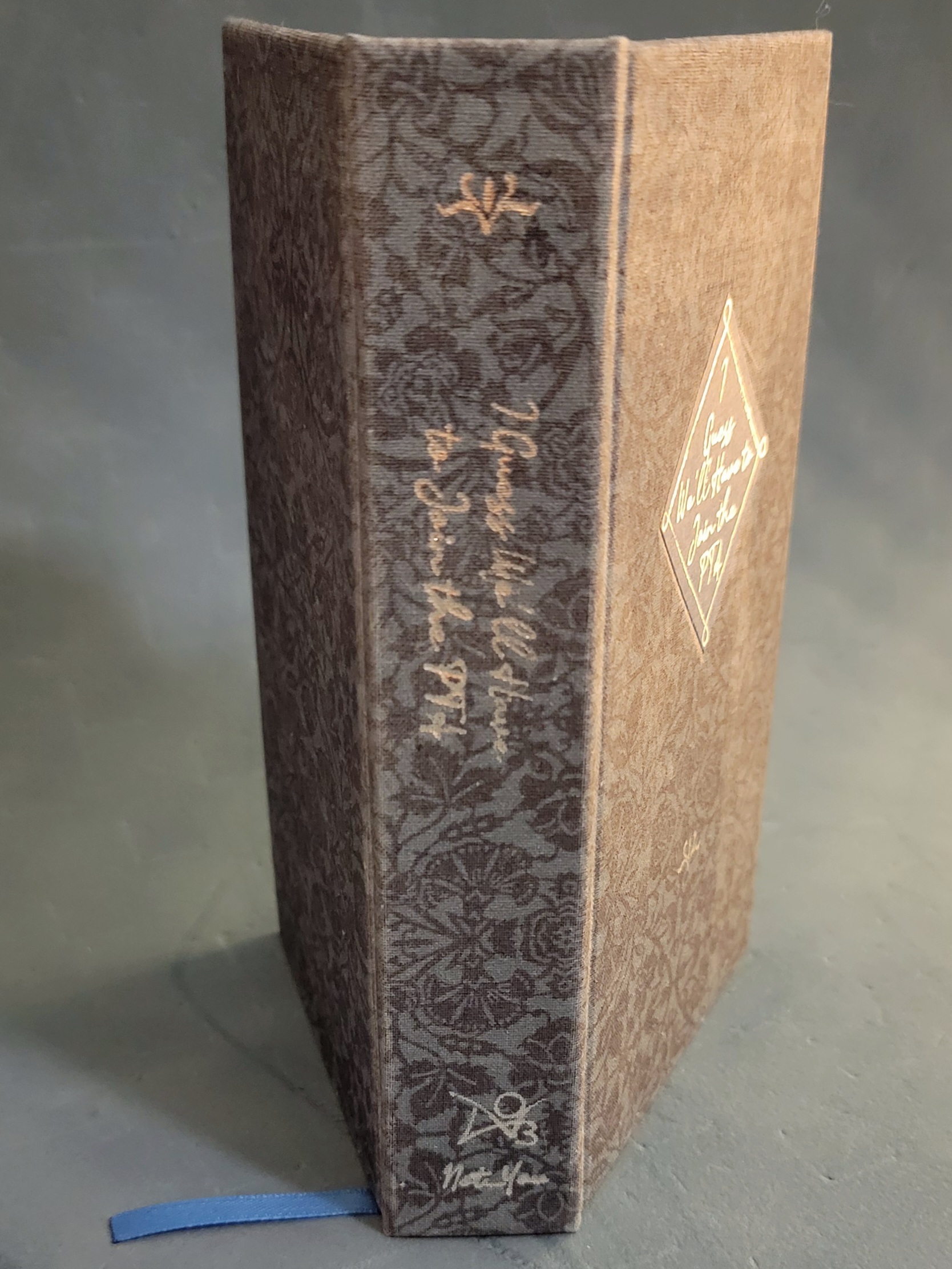 book with blue spine and foiled title